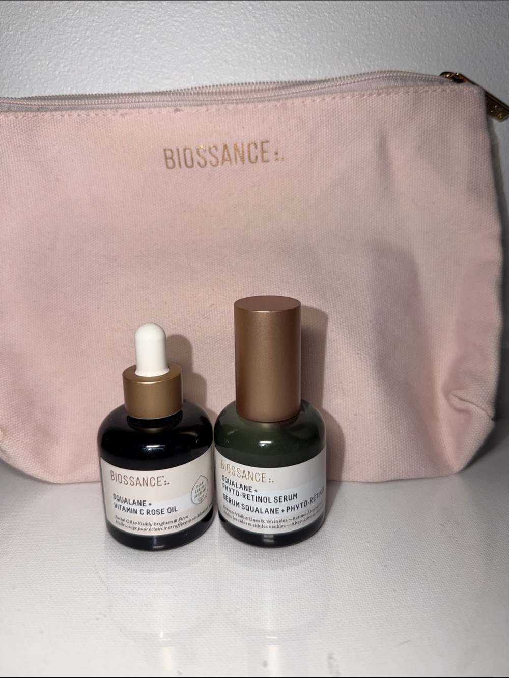 Biossance full size serum duo with light pink pouch